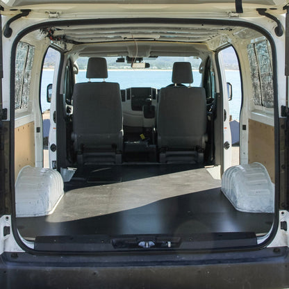 Van interior with flatbed at a scenic location