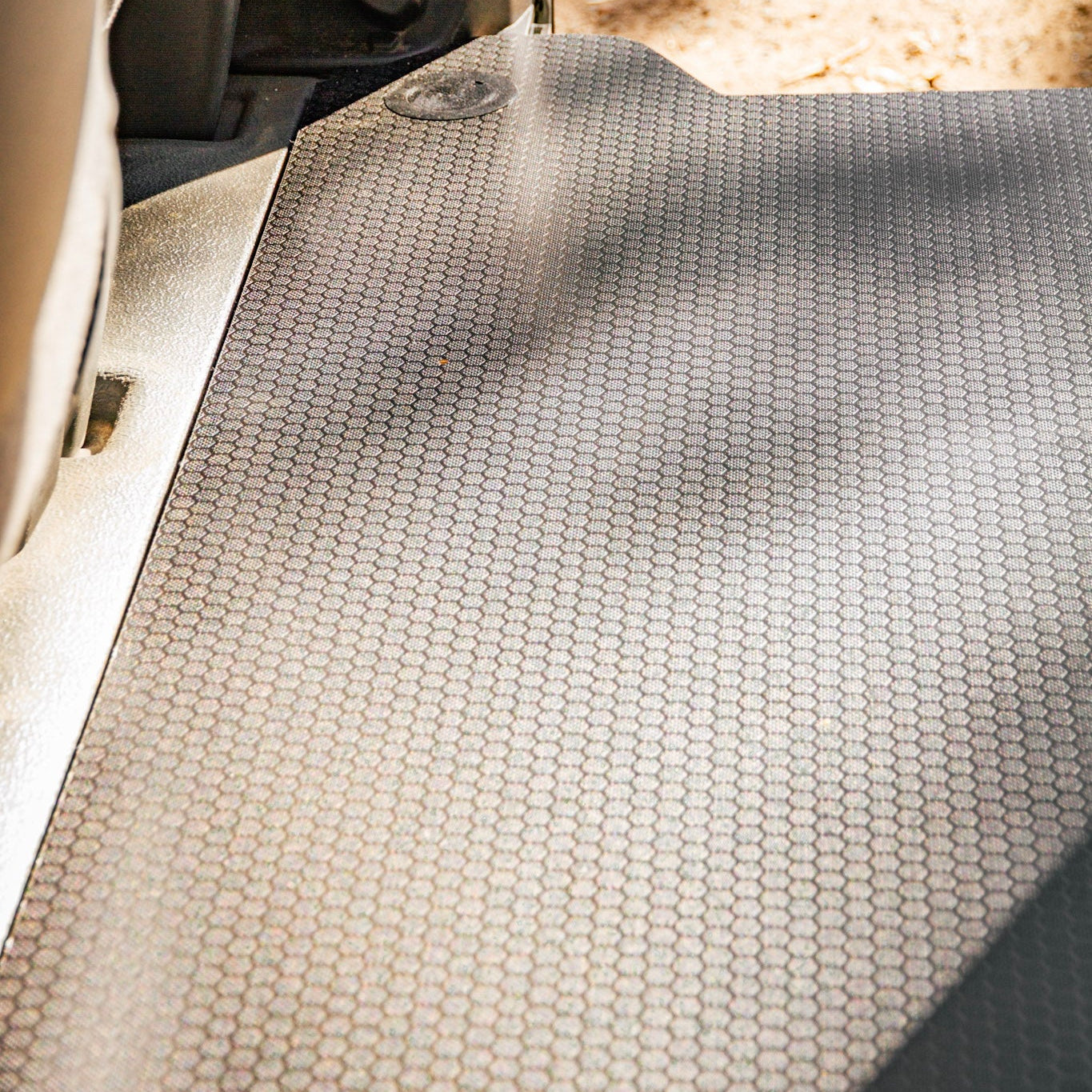 Car interior with a textured mat on the floor