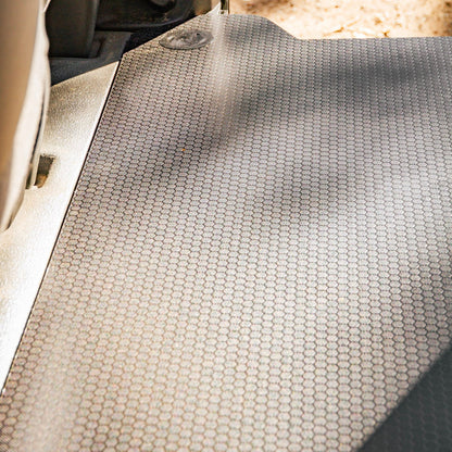 Car interior with a textured mat on the floor